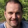 Larry M., content smile and warm expression, small crop